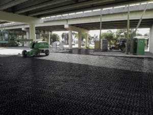 underpass permeable parking installation, underpass permeable pavement installation, permeable parking lot design, interlocking permeable pavers, truegrid permeable pavers installation