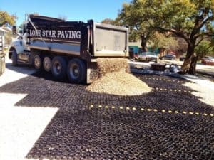 Gravel dumped on TRUEGRID permeable paving system.