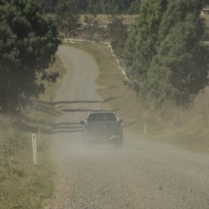 unstabilized ground, unpaved dirt road, rising dust, ground stabilization