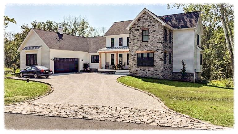 New home construction with gravel permeable driveway.