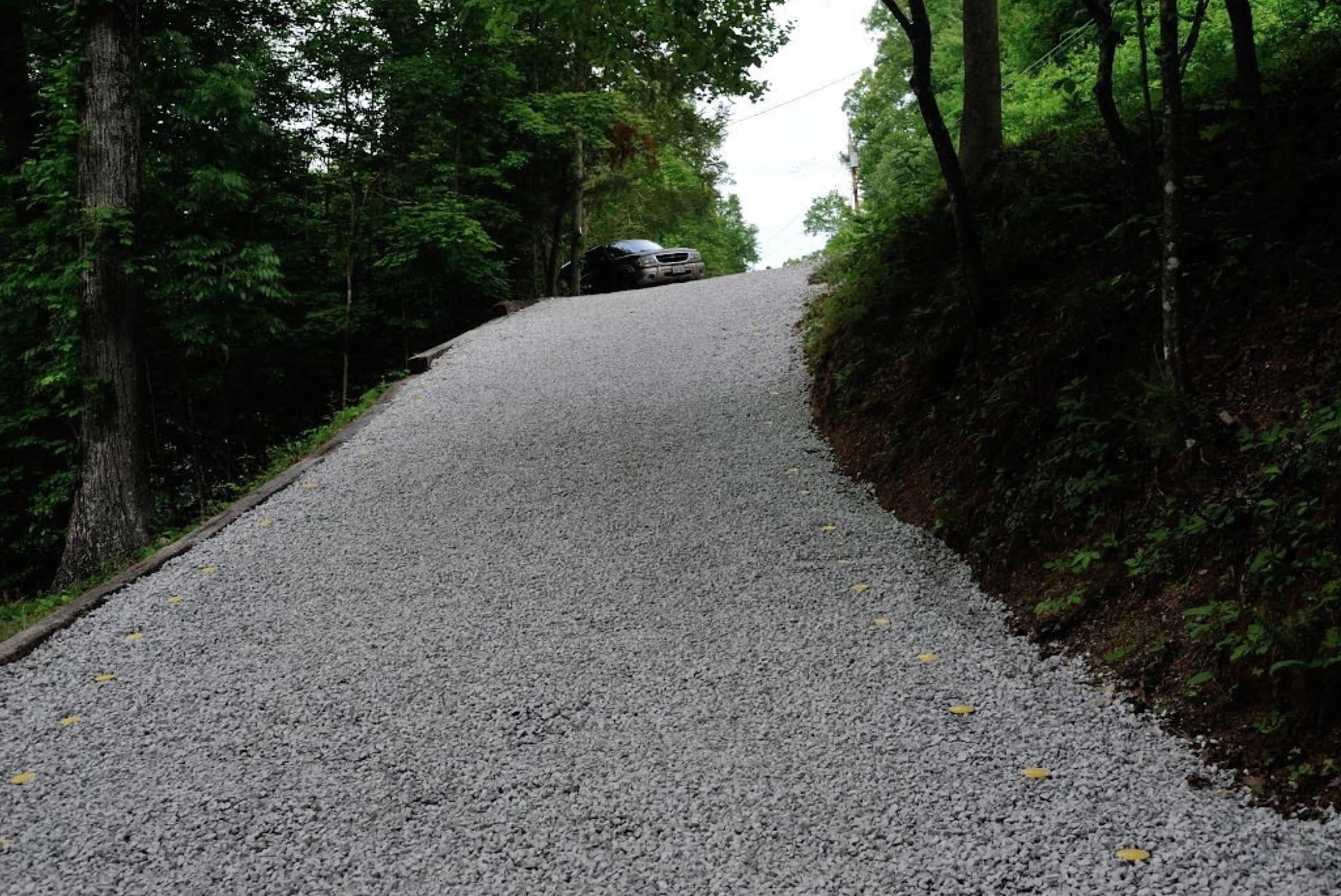 Driveway resurfacing bitumen and chippings gravel drive road asphalt tarmac 