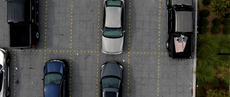 Aerial view of parking lot with yellow grid markings