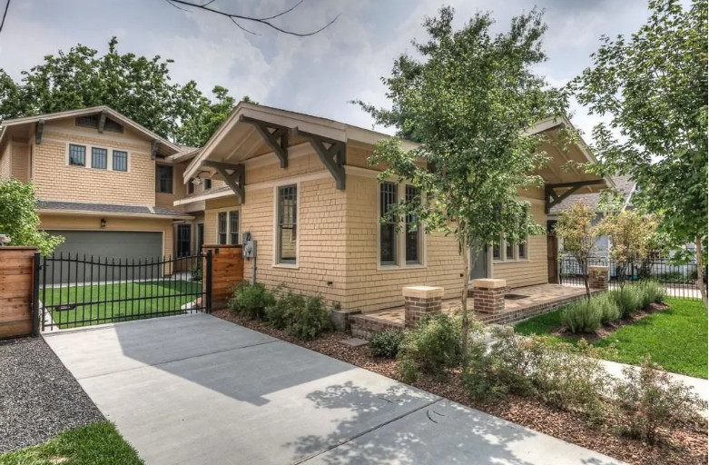 Craftsman-style house with shingle siding and landscaped yard