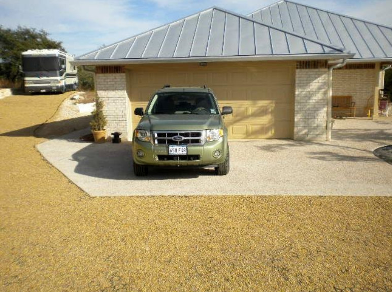 Sustainable crushed granite driveway with parked SUV