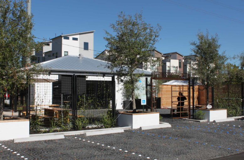 Modern building with accessible entrance and landscaped parking area