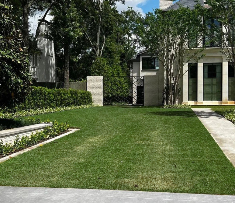 A grass driveway reinforced with grid pavers.
