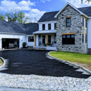 Permeable paver system being installed in a home's driveway.