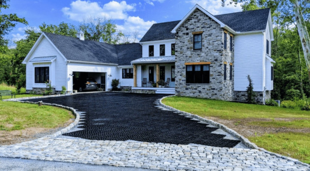 Permeable paver system being installed in a home's driveway.