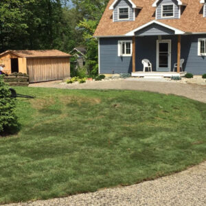 Farmhouse with a permeable paver driveway