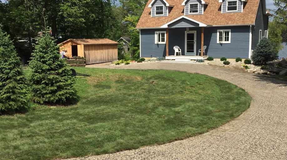 Farmhouse with a permeable paver driveway 