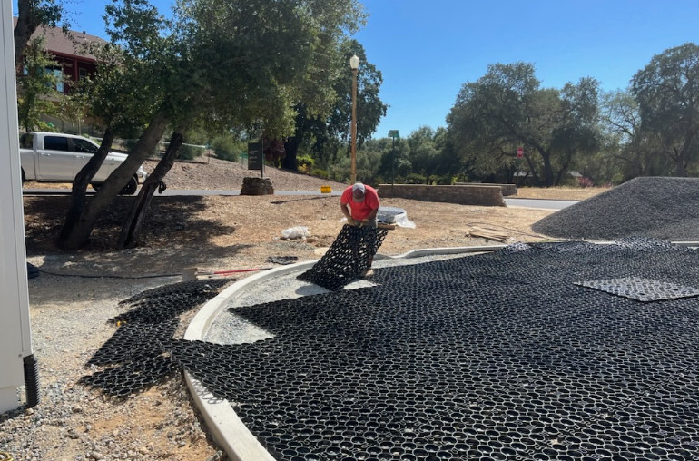 TrueGrid paver system being installed on a highly draining base layer