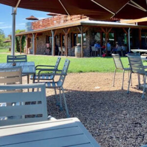 Permeable grid paver patio with proper drainage showing umbrellas and tables
