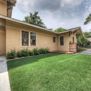 Residential yard with reinforced turf surface used as a less expensive alternative to gravel driveways.