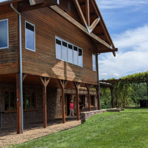 Combination gravel patio and gravel walkway demonstrating natural front yard paver walkway ideas.