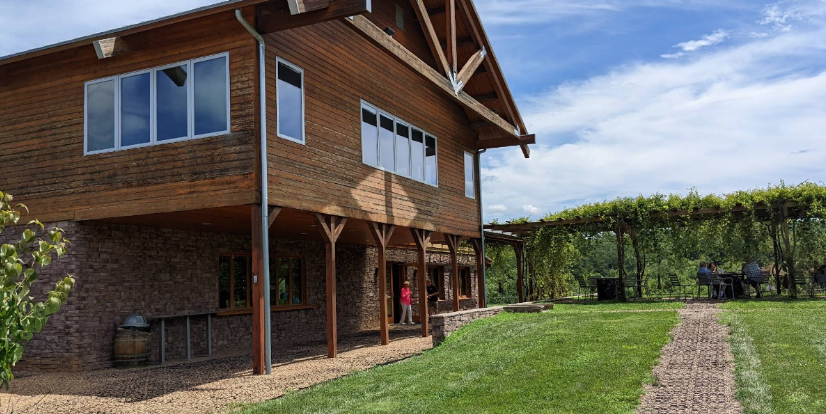 Combination gravel patio and gravel walkway demonstrating natural front yard paver walkway ideas.