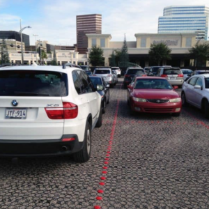 Commercial parking lot with permeable pavers designed for stormwater drainage.