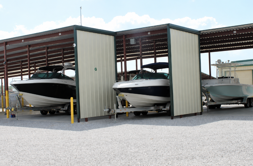 Covered boat storage facility with boats parked in individual open-sided storage bays.