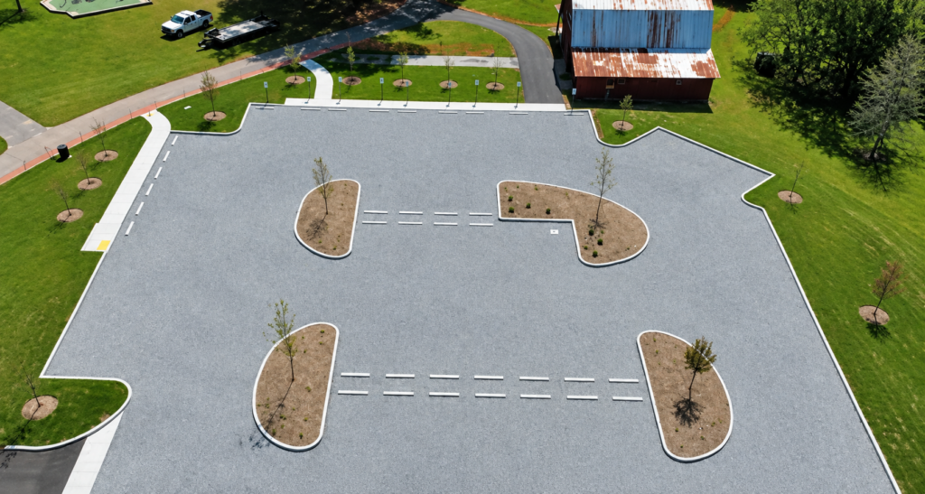 Permeable pavement system installed for a municipal parking area with landscaped islands.