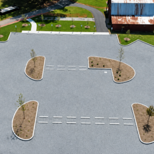 Permeable pavement system installed for a municipal parking area with landscaped islands.